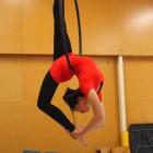Brophy Aerial Studios artist Anna Brunt (15) swings high above the floor at Carisbrook Primary...
