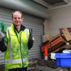 Lucas Hall sorts through circuit boards at Cargill Enterprises. Photo: Simon Henderson