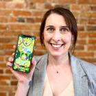 Runaway Play chief executive Zoe Hobson displays the butterfly-themed mobile game available to...
