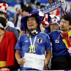 Supporters of Japan show their dismay after being knocked out of the cup, beaten by Croatia in a...