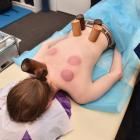Wyatt Ryder lies face down, ready for acupuncture needles to be placed across his body. PHOTOS:...