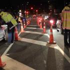 Officers test for alcohol in Quarry Rd, Mosgiel during a checkpoint last Friday night. PHOTO:...
