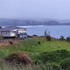 McNeilly Heavy Haulage transports a new warden’s house over Florence Hill, near Papatowai in the...