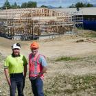 Cook Brothers Construction site manager James Feather (left) updates West Otago Health Ltd...