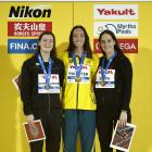 Silver medallist Erika Fairweather (left), of New Zealand, poses with gold medallist Lani...