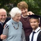 Graduand Michael Heldsinger (right) celebrates with his family (from left) David Heldsinger, of...