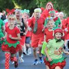 All dressed up and ready to run at 8am on Christmas Day. Leading the pack are sisters (from left)...
