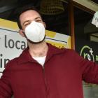 Mickey Treadwell picks up some free supplies at Roslyn Pharmacy in Dunedin yesterday afternoon in...