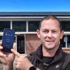 Sawyers Bay principal Gareth Swete shows off the app tracking how much power the school's solar...