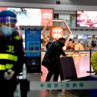 A traveller at a checkpoint at China's Chengdu Shuangliu International Airport at the weekend. A...