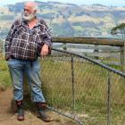 Doug Hall stands next to one of the gates on his walking track which is frequently left open by...
