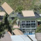 Scaffolding surrounds the mathematics block at Logan Park High School after mould was found at...