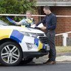 Police work outside a property in Helensburgh Rd, Wakari, Dunedin, after a woman’s body was found...