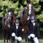 Kneeling with their horses Brewy (left) and Moose are Emily (11) and Annabel (14) Hutton at the...