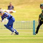 Otago Sparks batter, Polly Inglis, plays a shot on the leg side in front of Central wicketkeeper,...