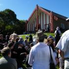 The crowd listens to speakers at the Otakou Marae meeting house Tamatea during a previous Ngai...