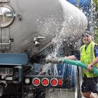Dynes truck driver Tyler Anderton fills a tanker with water in Dunedin yesterday as a lack of...