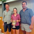 Central Otago merino junior judging competition winner Kate Campbell is flanked by Simon Paterson...