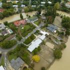 Homes and belongings inundated by mud and silt in Gisborne. Dunedin has adopted the East Coat...