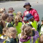 Te Anau School principal Grant Excell is welcomed by pupils and staff after a nine-day...