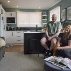 Interior designer Rachel Covey and her fiance Josh Nicholls relax in the living area of their...