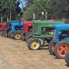 An admirer takes a photo of the long row of heritage tractors displayed by the East Otago Vintage...
