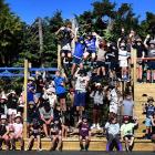 Pupils of Outram School enjoy the first day of school with a new $150,000 playground yesterday....