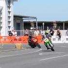 Taking a corner during the street race in Invercargill yesterday are Alan Henry (left), of North...