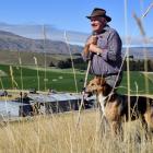 Beau Trevathan and Mick survey the scene at the Tarras dog trials this week. PHOTO: STEPHEN JAQUIERY