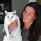 Christina McBratney with her cat, Buster, who has been returned after disappearing three years...