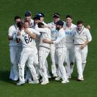 Black Caps man of the hour Neil Wagner (third from left) gets a hug from wicketkeeper Tom...