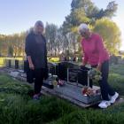 Christine Coster and her 91-year-old mother Kathleen at Aubrey’s grave, near the earthquake...