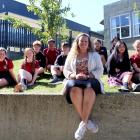 Lydie Leurquin gathers with year 10 social studies pupils at Logan Park High School during a...