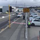 Police establish a cordon at the site of the alleged drive-by shooting in Thomas Burns St on...