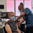 Prime Minister Chris Hipkins getting his flu vaccine and Covid booster shot at Queen Street...