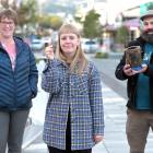 Holding old pipes of different types in George St, Dunedin, are (from left) Heritage New Zealand...