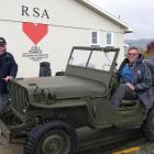 Owner Dwain Devereux  (right) and West Otago RSA president Colin McDonald put a restored 1942...