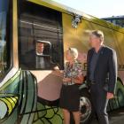Riding in the newly unveiled electric book bus Dunedin Mayor Jules Radich (left) was given a tour...