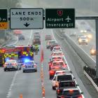 Emergency services vehicles block lanes of the Southern Motorway after a seven-car pile-up...