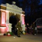 A soldier stands guard at the memorial gates at the Queenstown Anzac Day Dawn Service this...