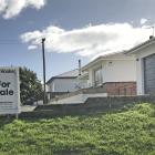 Signs advertise houses for sale in East Otago but few are available to rent. PHOTO: STEVE HEPBURN