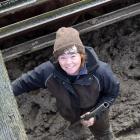 Upper Manuherikia Young Farmers Club president Hope Oliver, of Lauder Creek, shuts a gate droving...