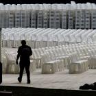 A worker walks past seating being laid out at Forsyth Barr Stadium yesterday, in preparation for...