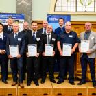 Representatives from groups awarded the Certificate of Achievement (from left) Paul Rogers,...