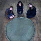 Artists (from left) Lucy Hill, Yana Dombrowsky-M’Baye and Taarn Scott look at Dombrosky-M’Baye’s...