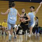 St Kilda Saints guard Liam Aston tries to beat University defenders Ben Harding (left) and Ethan...