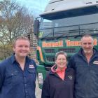 John Simpson (left), the new boss of Bennett Transport, with previous owners Jim and Mel Bennett...