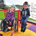 Best friends Scarlette Ryder and Josh Rudd take a turn on the new roundabout at Hudson Park in...