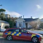 Police guard the scene of a shooting at a Tees St house in Oamaru on Saturday. PHOTO: JULES CHIN