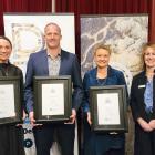 Bridget Tweed (left), Frank O’Boyle and Larissa Brown after being presented with their chartered...